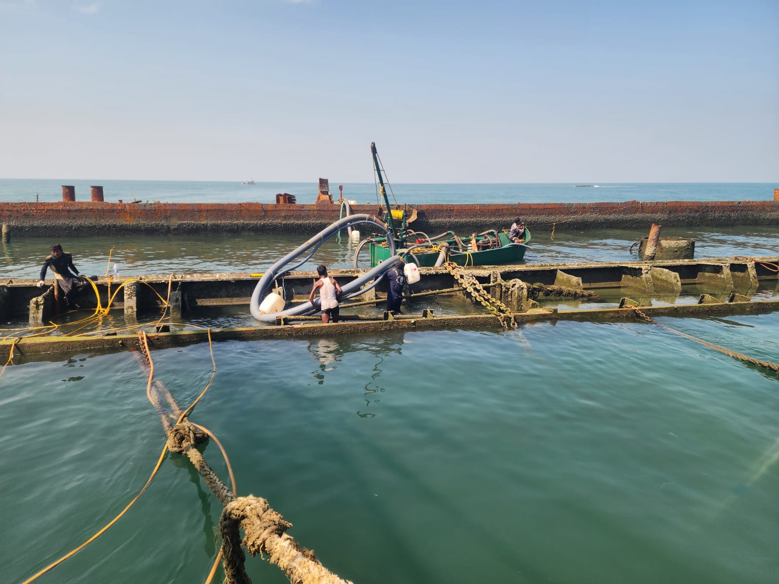 Marine team laying underwater pipeline